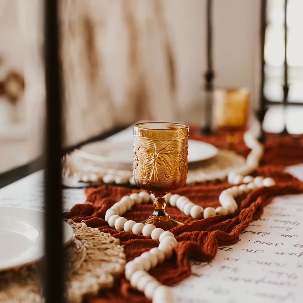 Wedding reception table details with candles and pearls