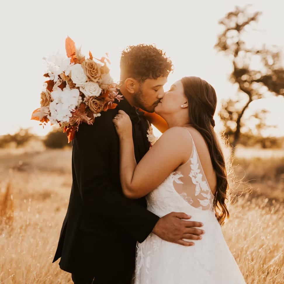 Bride and groom kiss