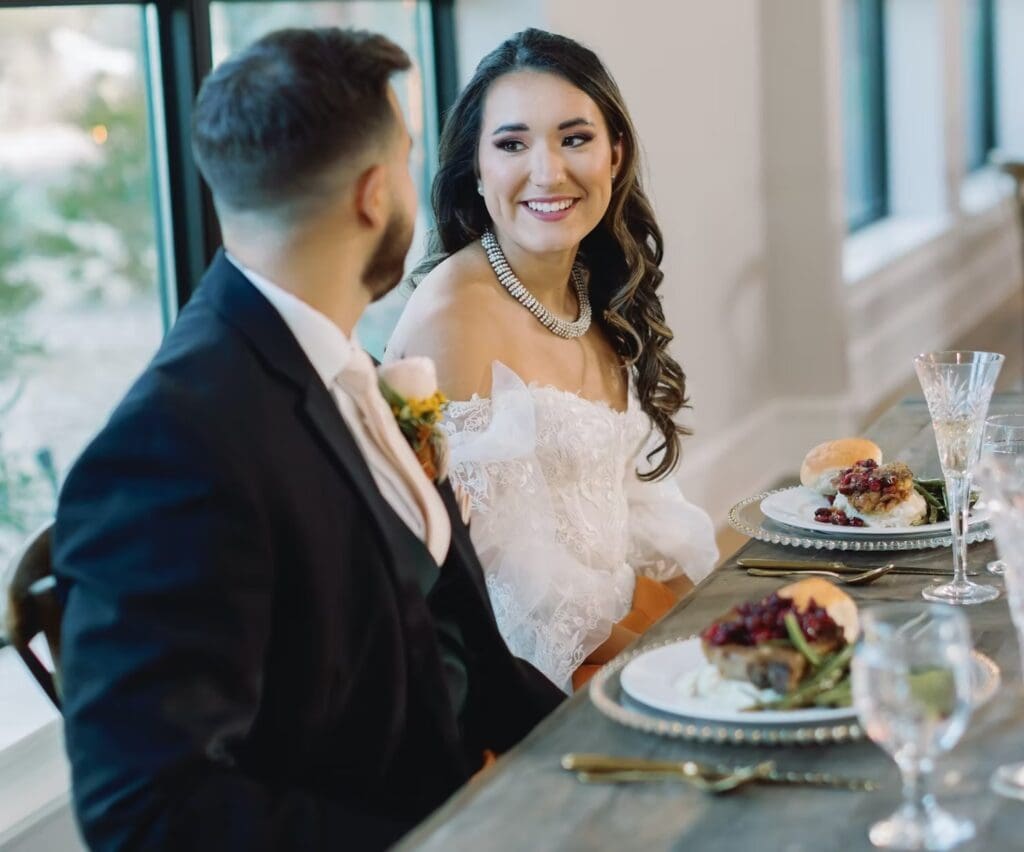 Bride and groom eating dinner together