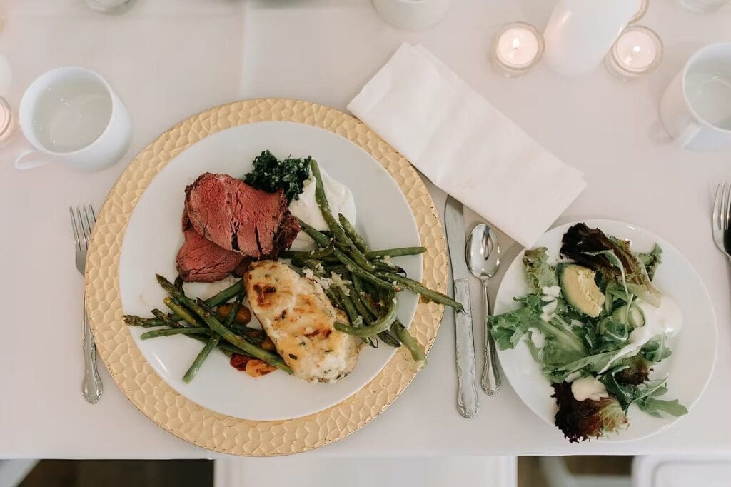 Plated steak dinner and salad