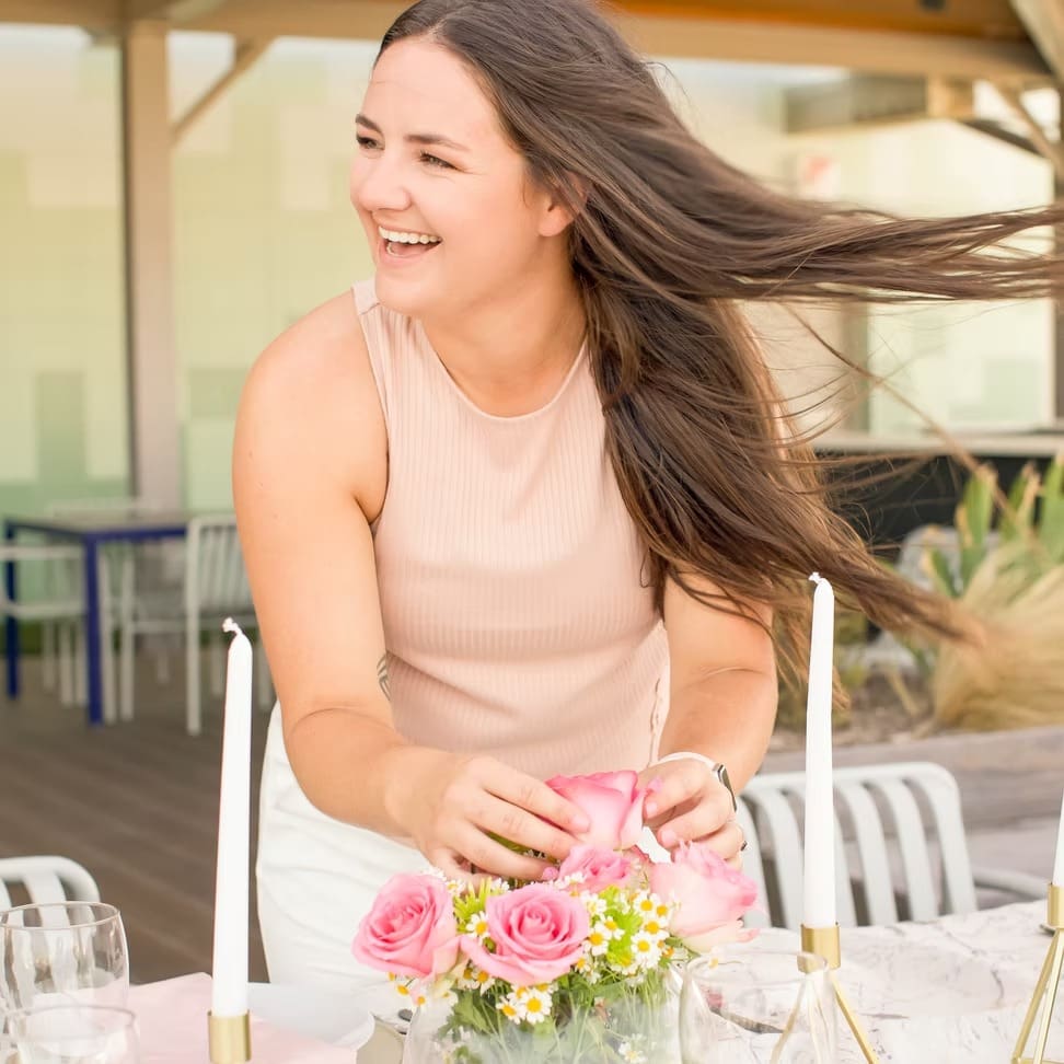 Wedding planner arranging florals